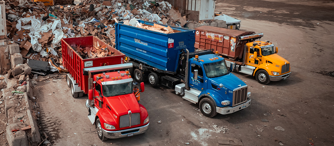 DTG trucks dropping off material to be recycled